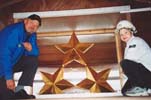 Juris Ramba and son Roberts at the finished stars of the Freedom monument in Riga.